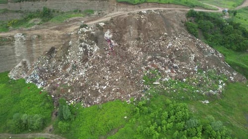 Aerial View of Landfill with People Picking Trash
