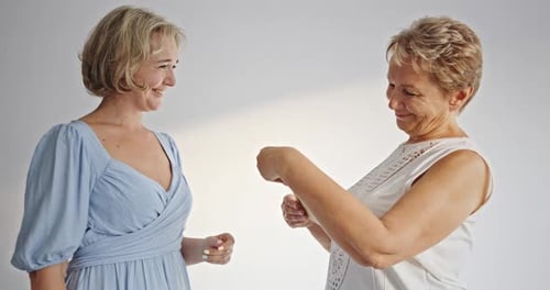 Woman Giving Mother Handmade Birthday Card