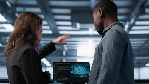 Software Developers in Data Center Using Laptop Employing AI Machine Learning