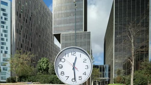 Clock with Time Passing During 1 Hour in City Skyline
