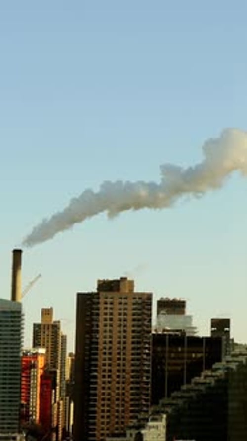 Urban Landscape Featuring Emissions and Tall Skyscrapers in a Bustling City Environment
