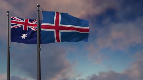 Realistic Australian and Icelandic Flags Waving Against Blue Sky