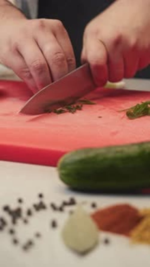 Chef's Skilled Hands Skillfully Cut the Green Onions Into Small Pieces Vertical