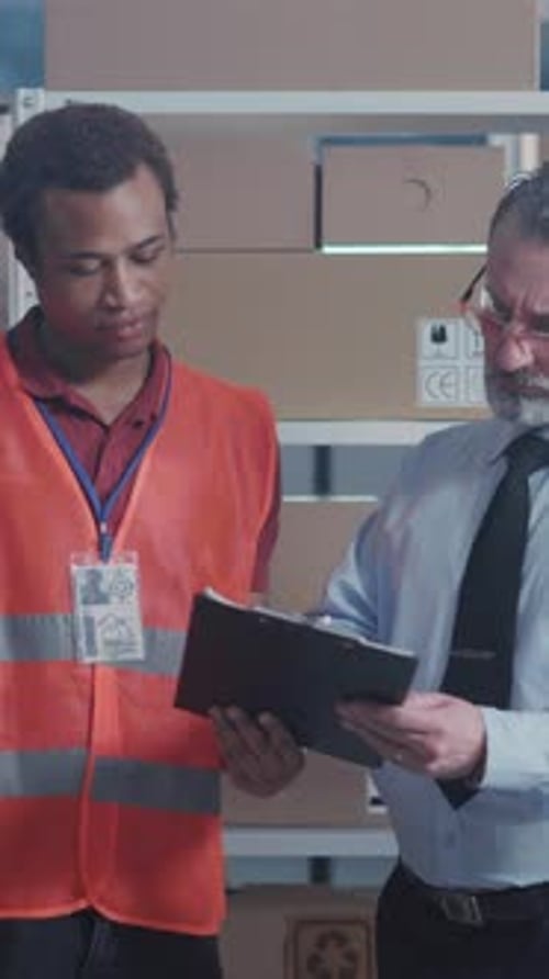 Couple of Handsome Men Cooperating at Post Office Company Caucasian and African Executives Working