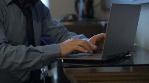 Busy Businessman Working on Laptop Sitting in Office Adult