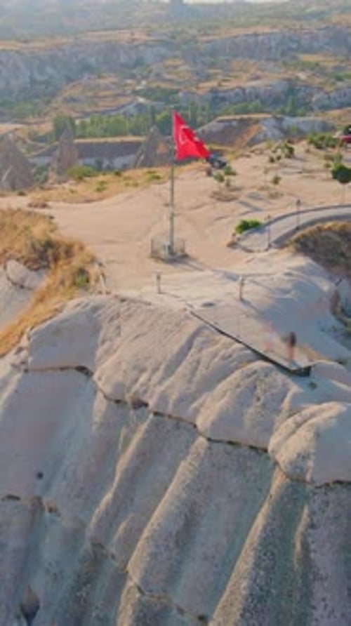 Vertical Video Aerial Shot of Goreme Cappadocia Turkey The Ancient City Unfolds Below Revealing Its