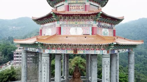 Buddha Statue at Kek Lok Si Temple, Penang Malaysia, Rising Drone Shot