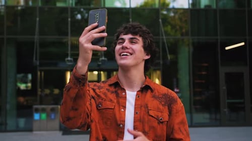 Casual Man Having Video Call on Smartphone in Slow Motion Close Up Guy Making Video Chat Online on