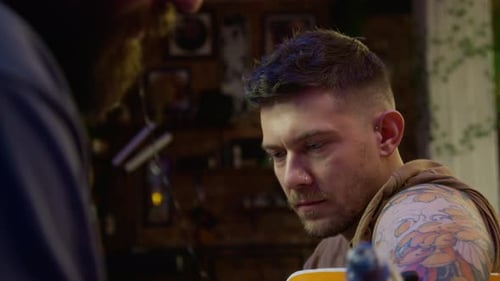 Young Man Getting New Tattoo in Professional Studio