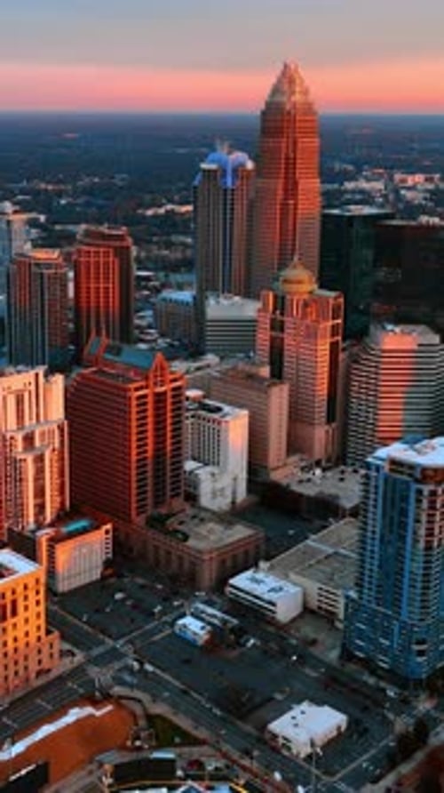 Facades of high-rise buildings in the light of setting sun. Charlotte, North Carolina, USA.