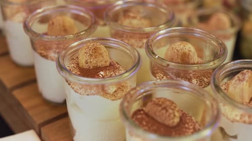 Desserts in Glass Jars Topped with Cocoa