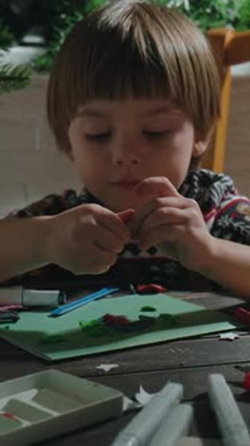 Vertical Video Small Boy Creating Christmas Greeting Card at Home
