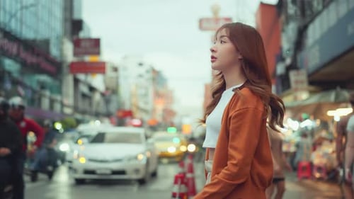 Happy young tourist asian woman walking in the street Chinatown Yaowarat Bangkok urban city