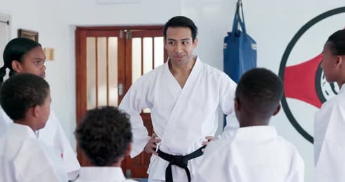 Martial Arts Instructor with Children in Gi