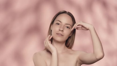 Young Woman Posing with Bare Shoulders and Smiling