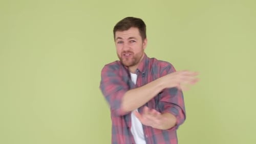 Funny Dance of a Man in Simple Clothes on the Background in the Studio Happy European Man Dancing