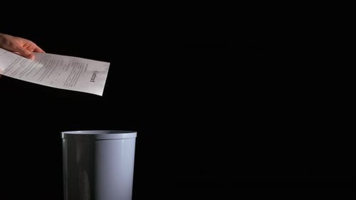 Contract Thrown Away in Trash Can