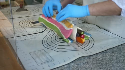 The Process of Making Multicolored Lollipops in a Confectionery Kitchen