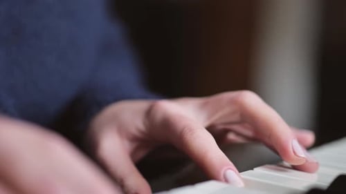 Close Up of Adult Playing the Piano