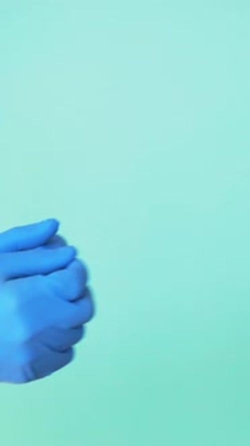 Hands in Gloves Passing a Gift