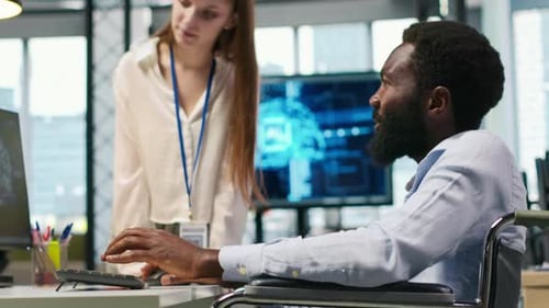 Young Engineer and Coworker with Paraplegia Using AI Doing Brainstorming