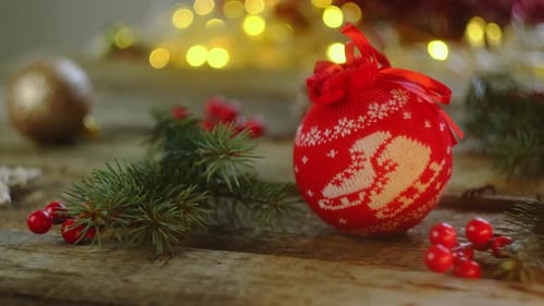 Festive Christmas Ornaments and Lights on Wooden Table