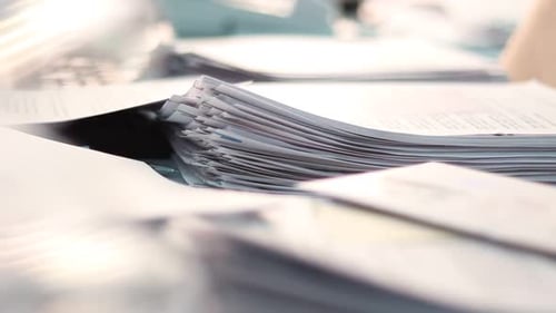 Stack of Papers and Documents in the Office