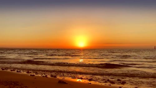 Bright red sunrise at beach