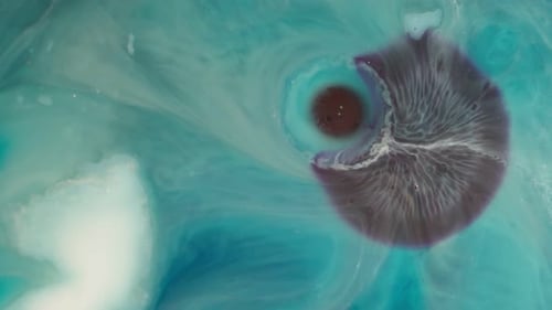 Diffusion d'encre abstraite aux tons violets et bleu sarcelle