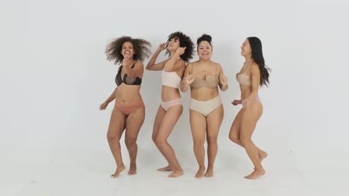 Women Friends Dance Together in Lingerie