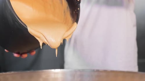 Pouring Batter Into Mixing Bowl Close Up