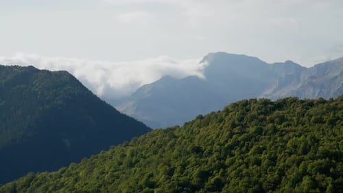 Clouds Drift Over Verdant Hills in Tzoumerka Region