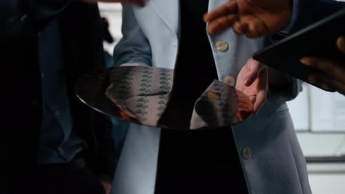 Close Up of Diverse Researchers Examining Silicon Wafer in Factory Office