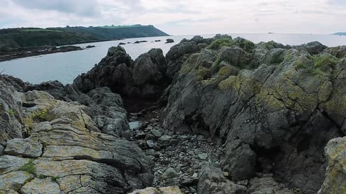 Peaceful Seaside Landscape with Natural Elements Tranquil Seaside Scene Featuring Waves and Cliffs