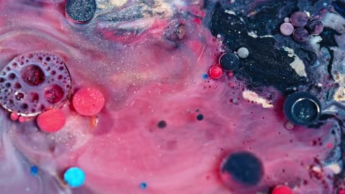 Vivid pink and black ink swirling in water, creating an abstract fluid art scene, close-up