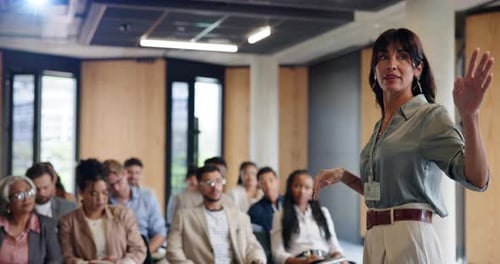 Speaker Presents to Audience at Business Conference