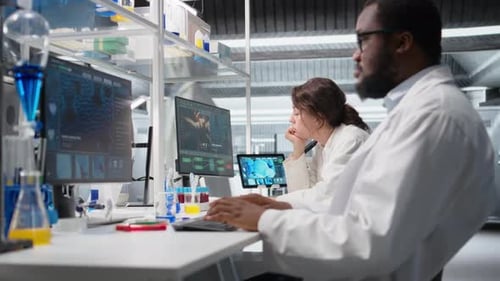 Scientists Collaborate, Analyzing Data in a Modern Lab