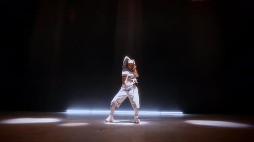 Vibrant Hip Hop Dance By Woman In Studio With Matrix Beam Lighting
