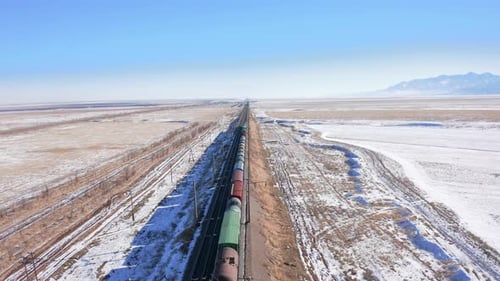 Flight along the railroad and a view from the top of the roofs of a moving train