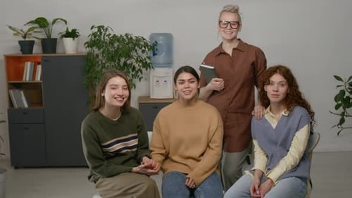 Group of Smiling Women Posing in Office
