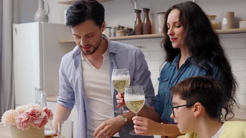 Family Celebrating Together at Home in the Kitchen