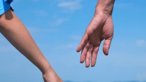 Hand of Mother and Child