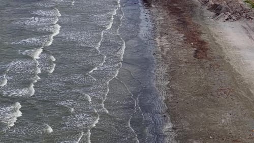 Ocean waves create zigzag patterns on the water surface