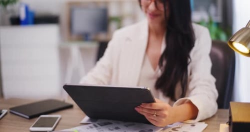 Closeup of Businesswoman Using Digital Tablet in Office