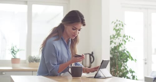 Young Woman Shops Online at Home with Tablet
