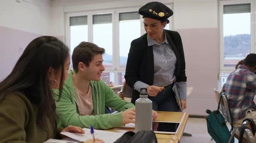 Teacher Interacting with Students in Classroom