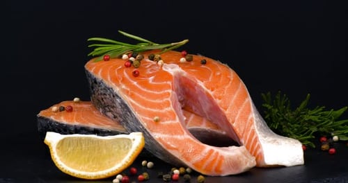 Trout Steaks Rotation Video. Raw Slices with Perfect Texture of Uncooked Red Fish. Sea Food