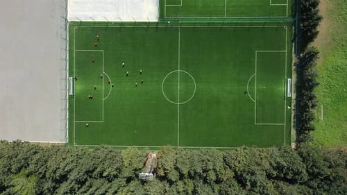 Aerial View Of Players Playing At Green Soccer Field In Tbilisi, Georgia.