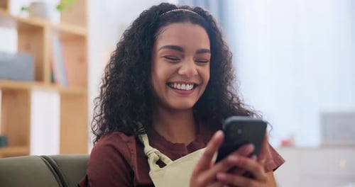 Woman, laughing and internet with phone on sofa for text message, social media post