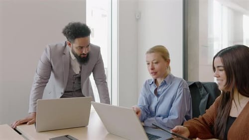 A Diverse Business Team is Collaborating Effectively in a Modern Office Environment